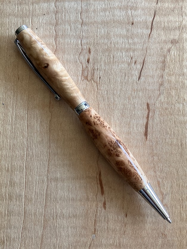 24.) Hand turned natural maple burl wood pen